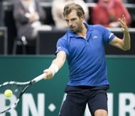 France's Julien Benneteau returns the ball to France's Gilles Simon in Rotterdam on February 16, 2013